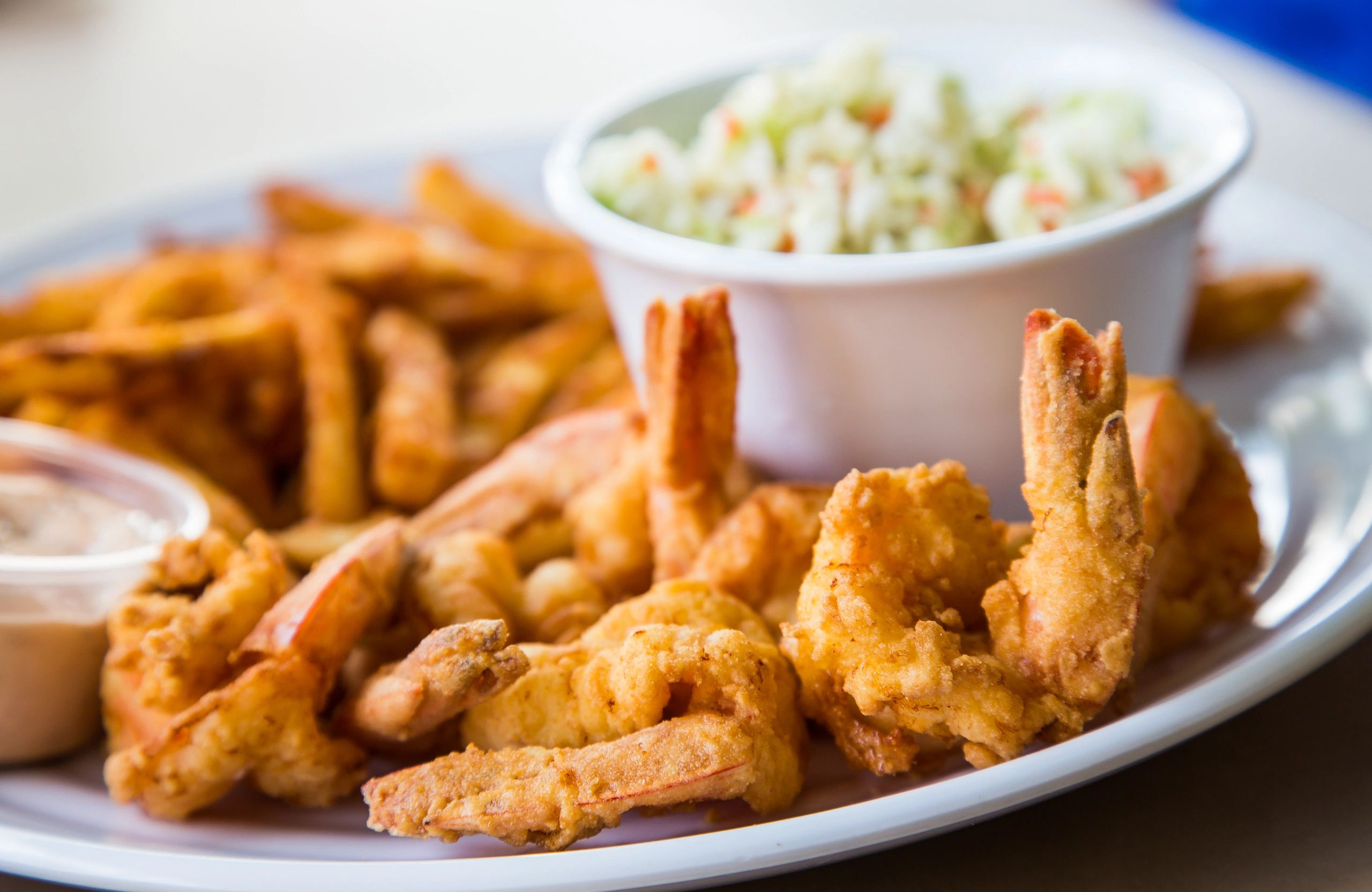 fried shrimp platter with fries hush puppies coleslaw restaurant